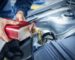 mechanic-changing-engine-oil-on-car-vehicle_342744-260